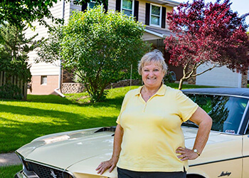 Carol in Front of a Car