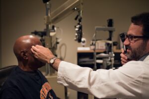 eye doctor giving patient an eye exam