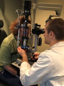 eye doctor examining a patient 