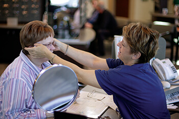 Woman being fitted with eyeglasses